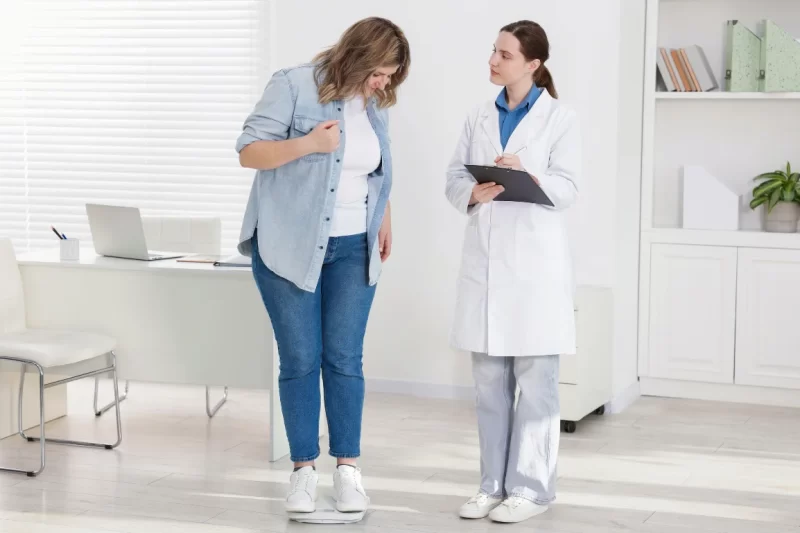 Patient consulting with provider about GLP-1 weight loss injection candidacy at New Horizons Wellness Center in Spring TX